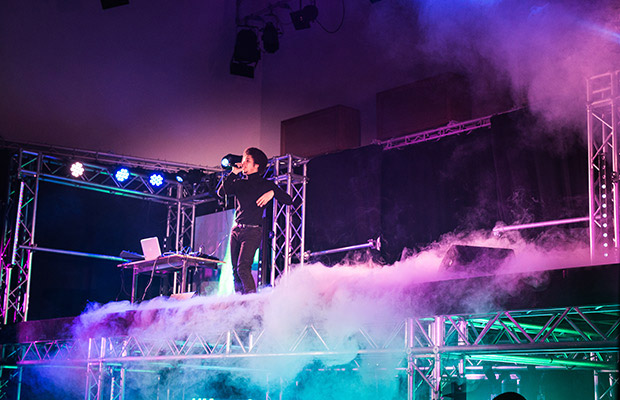 stage with smoke and person performing