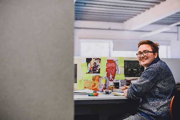 Cardiff Metropolitan University: Student at a desk, using the facilities