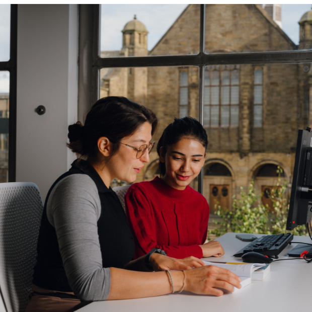 Bangor University - students sat at desk